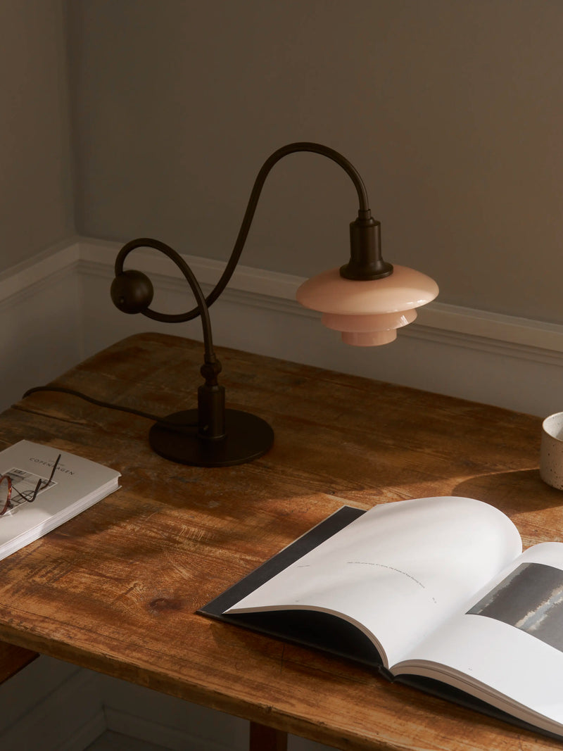 PH 1/1 Piano Table Lamp on a desk