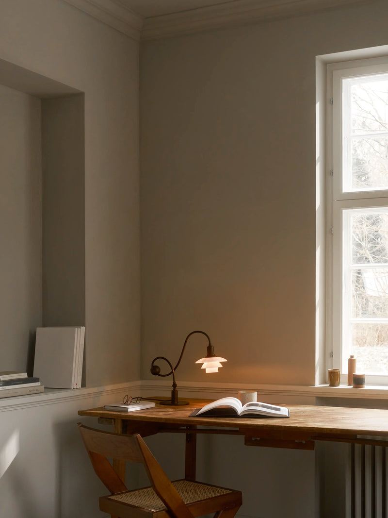 PH 1/1 Piano Table Lamp on a work table